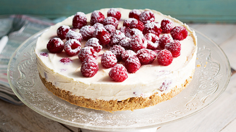 Raspberry cheesecake on a glass plate made with the Sainsbury's no bake cheesecake recipe